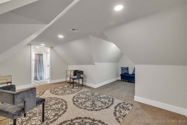 bonus room featuring lofted ceiling and carpet flooring