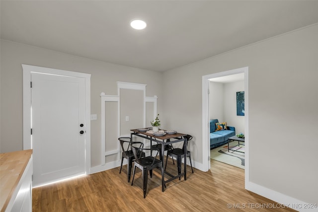 dining area with light hardwood / wood-style floors