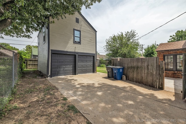 view of side of property with a garage