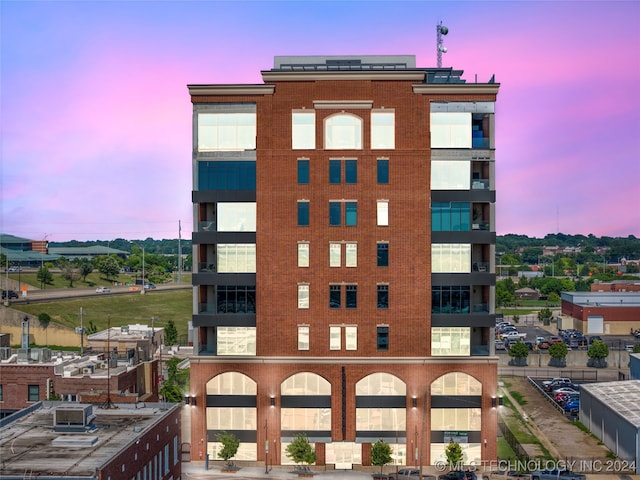 view of outdoor building at dusk