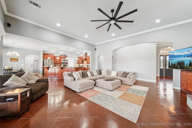 tiled living room featuring ceiling fan with notable chandelier and ornamental molding