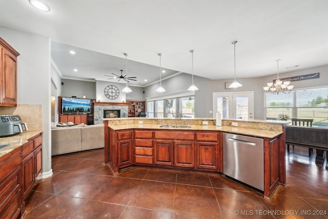 kitchen featuring a healthy amount of sunlight, a fireplace, ceiling fan with notable chandelier, and dishwasher