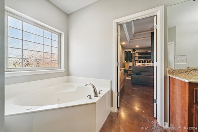 bathroom with a tub and tile patterned floors