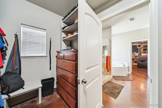 spacious closet with tile patterned flooring