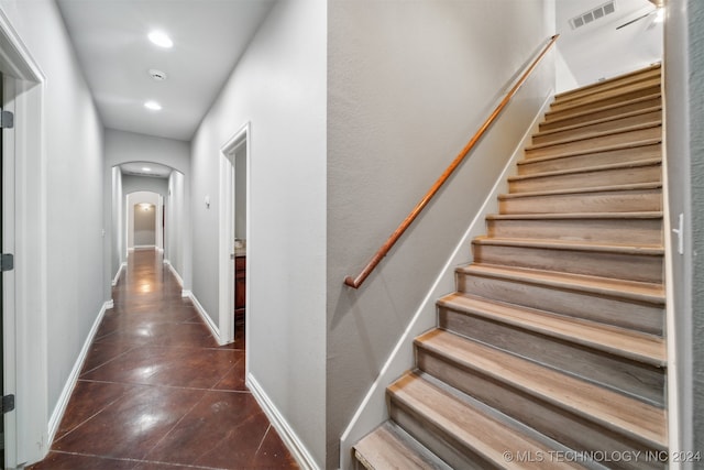 staircase with tile patterned floors