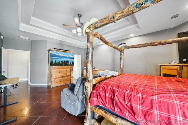 tiled bedroom featuring ceiling fan and a raised ceiling