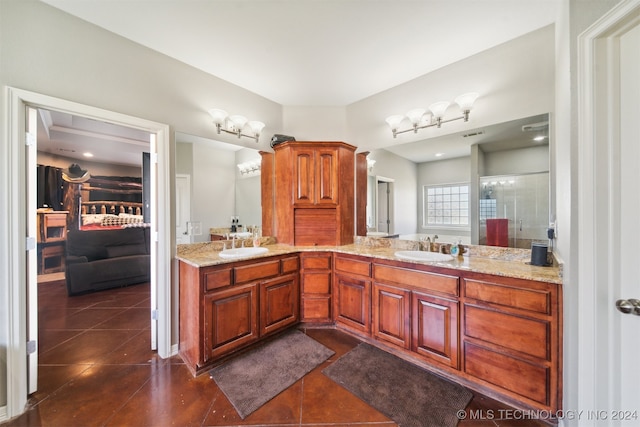 bathroom featuring walk in shower, tile patterned flooring, and vanity