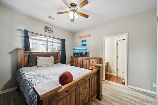 bedroom with light hardwood / wood-style floors and ceiling fan