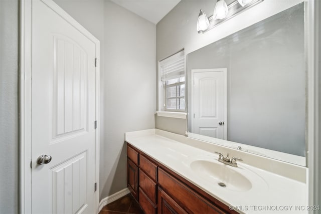 bathroom featuring tile patterned floors and vanity