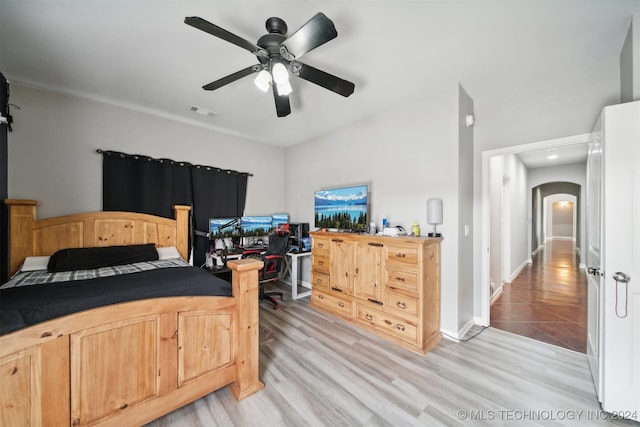 bedroom with light wood-type flooring and ceiling fan