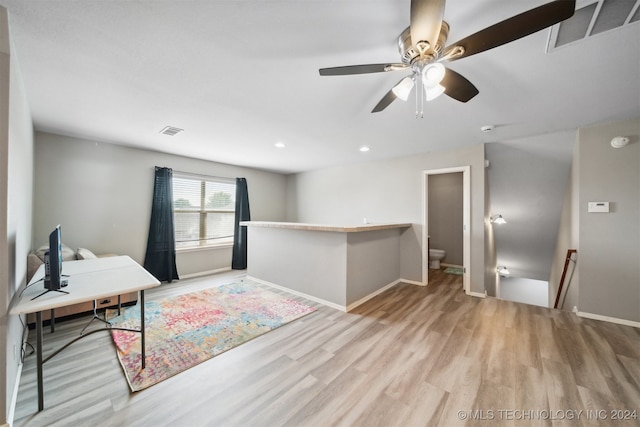 interior space with ceiling fan and light hardwood / wood-style flooring