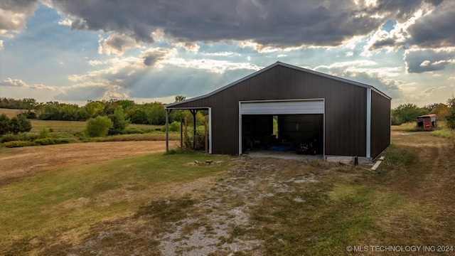 garage featuring a lawn