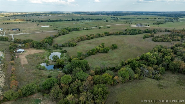 aerial view with a rural view and a water view