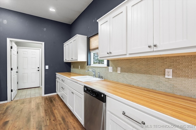 kitchen featuring dark wood-type flooring, white cabinets, backsplash, dishwasher, and sink