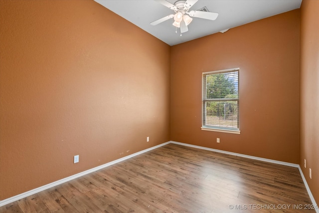 empty room with wood-type flooring and ceiling fan