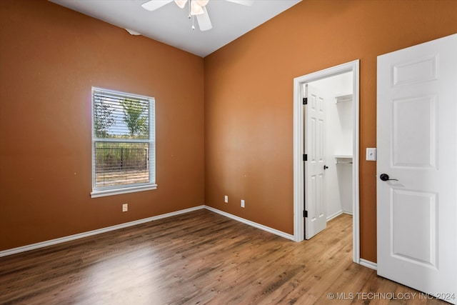 spare room featuring ceiling fan and hardwood / wood-style floors