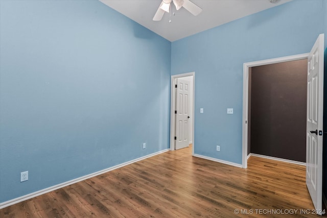 unfurnished bedroom with wood-type flooring and ceiling fan