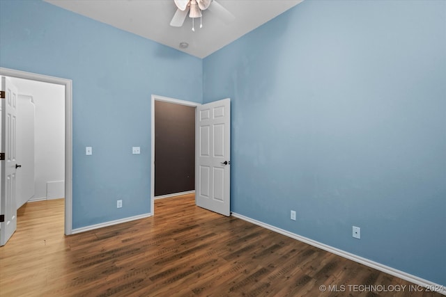 unfurnished bedroom with ceiling fan and hardwood / wood-style floors