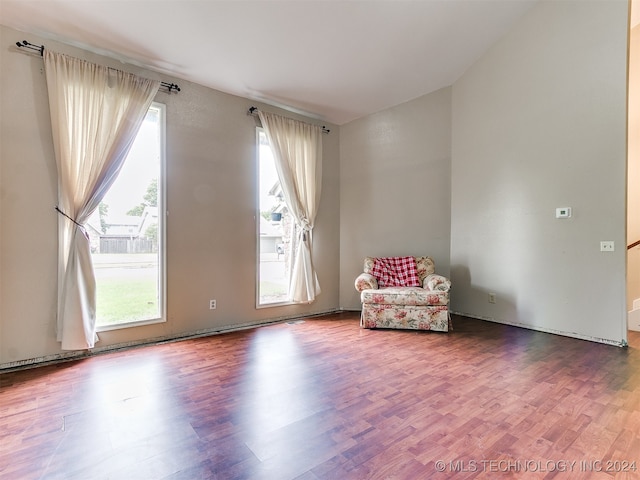 unfurnished room featuring hardwood / wood-style floors