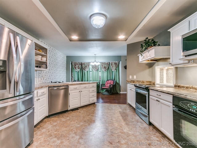 kitchen featuring a chandelier, white cabinets, hanging light fixtures, stainless steel appliances, and light stone countertops