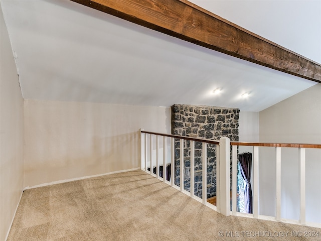 interior space featuring lofted ceiling and carpet