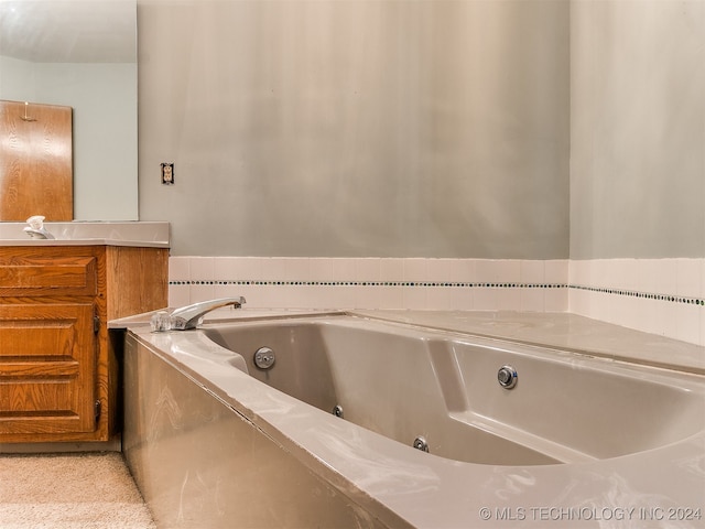 bathroom featuring vanity and a bathtub