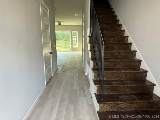 stairway featuring hardwood / wood-style floors