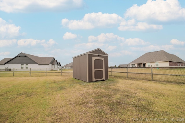 view of yard with a storage unit