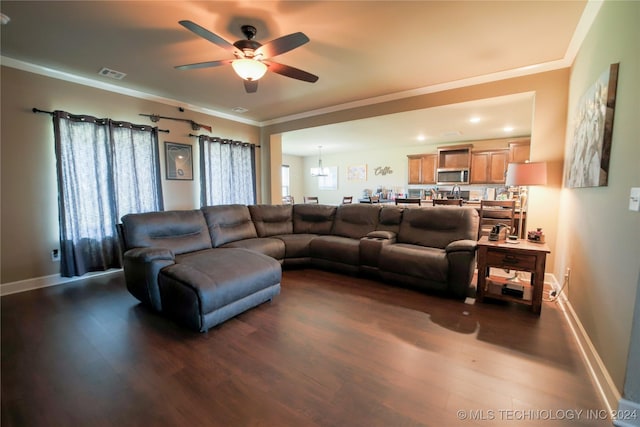 living room featuring crown molding, ceiling fan, and dark wood-type flooring