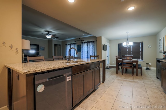 kitchen with dishwasher, crown molding, sink, hanging light fixtures, and dark brown cabinets