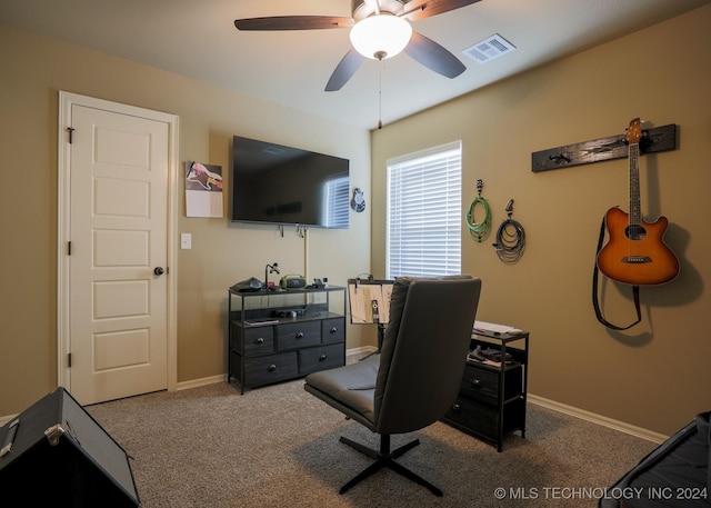 carpeted home office with ceiling fan