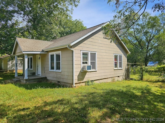 view of home's exterior featuring a lawn