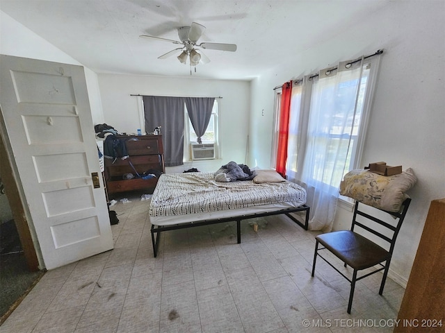 bedroom featuring cooling unit and ceiling fan