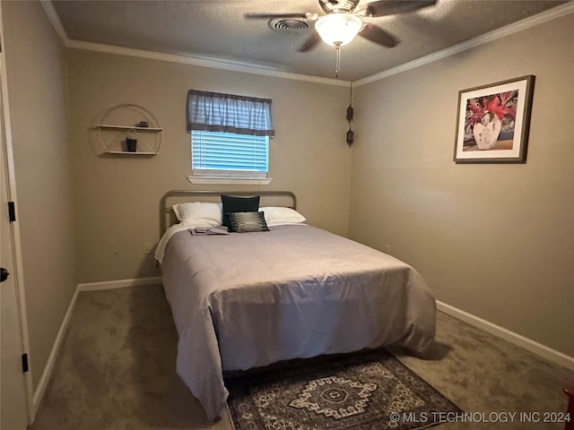 bedroom with ornamental molding, carpet, and ceiling fan