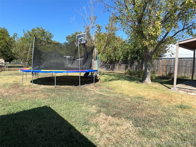 view of yard featuring a trampoline