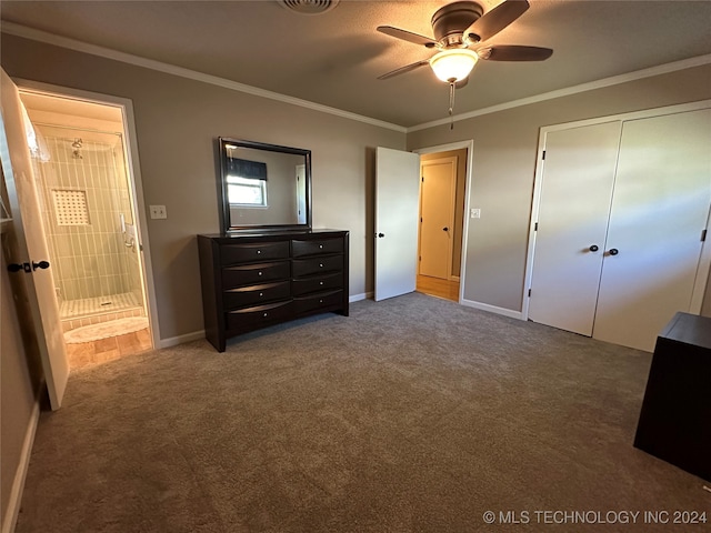 carpeted bedroom featuring crown molding, ceiling fan, and a closet