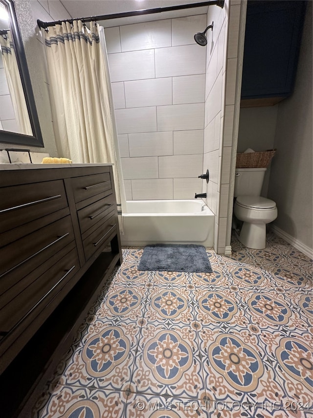 full bathroom featuring vanity, tile patterned flooring, shower / tub combo, and toilet