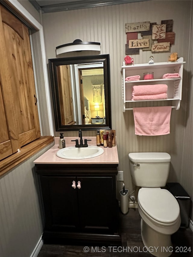 bathroom featuring vanity and toilet