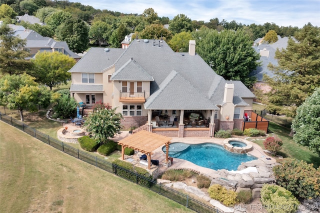 view of pool featuring a lawn, an in ground hot tub, and a patio area