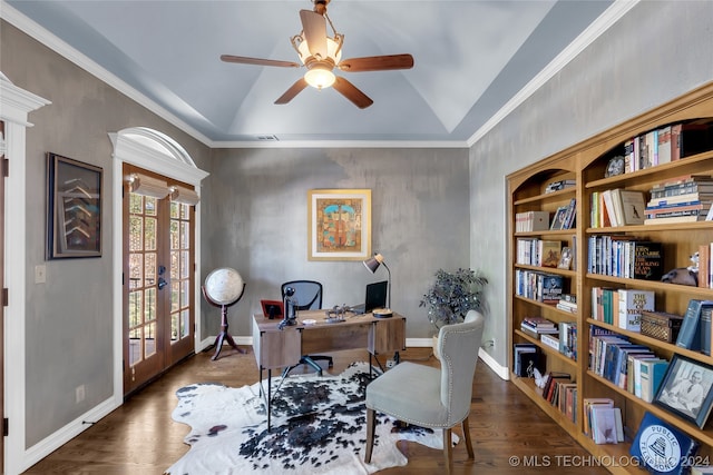 home office featuring dark hardwood / wood-style flooring, vaulted ceiling, crown molding, ceiling fan, and french doors