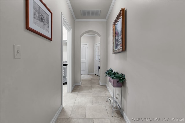 corridor featuring ornamental molding