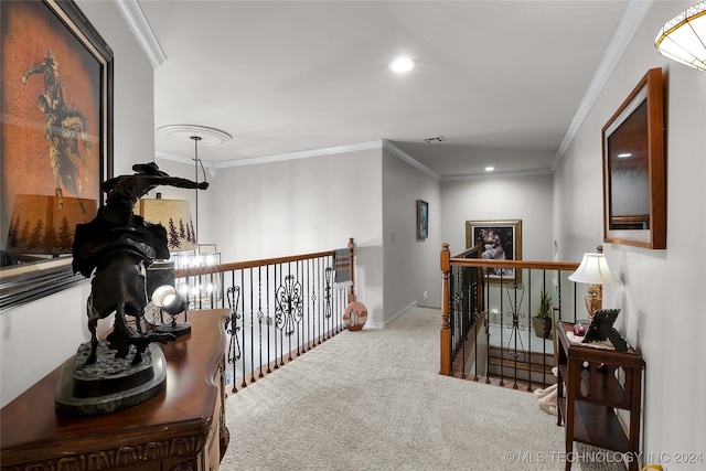 hall with crown molding and carpet flooring