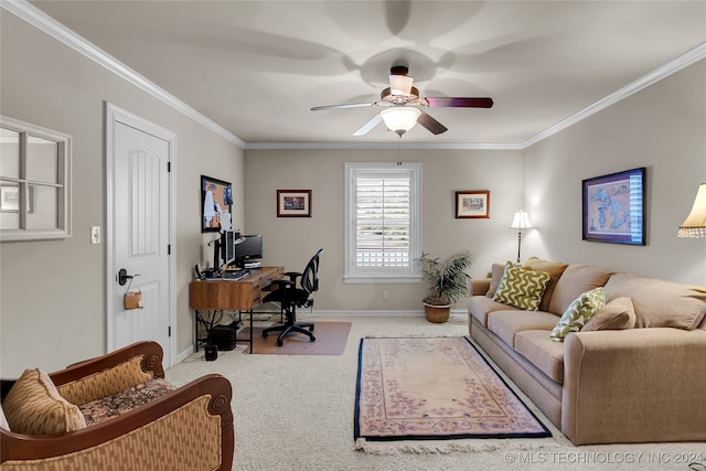 carpeted home office featuring ornamental molding and ceiling fan