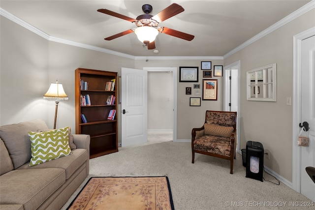 carpeted living room featuring ceiling fan and ornamental molding