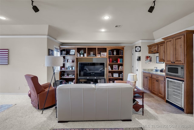 living room with light colored carpet, crown molding, and wine cooler