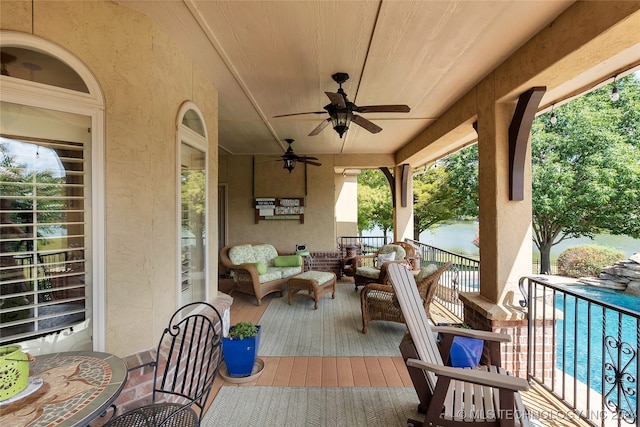 view of patio / terrace featuring ceiling fan and an outdoor living space