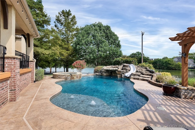 view of pool with an in ground hot tub, a water view, a water slide, and a patio area