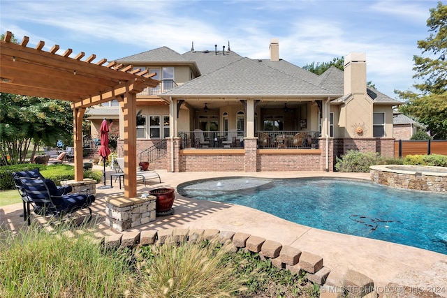 view of pool featuring an in ground hot tub, a pergola, and a patio area