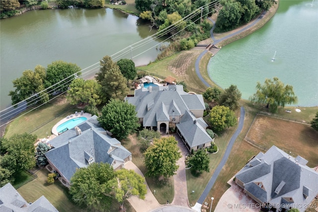 birds eye view of property featuring a water view