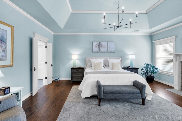 bedroom with an inviting chandelier, dark hardwood / wood-style floors, and crown molding